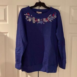 Woman within sweater. Blue with embroidered neck line. 14/16.